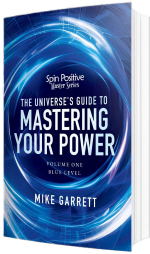 A paperback book with a blue cover. The cover shows swirling energy around the words "Spin Positive Master Series - The Universe's Guide to Mastering Your Power Volume #1 Blue Level. Near the bottom are the words Mike Garrett in all capital block letters. All typeface is in white.