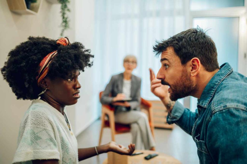 Portrait of a diverse couple arguing on a session with a psychologist in an office. Relationship problems, avoiding divorce. Diverse spouses fighting while visiting professional therapist for help.